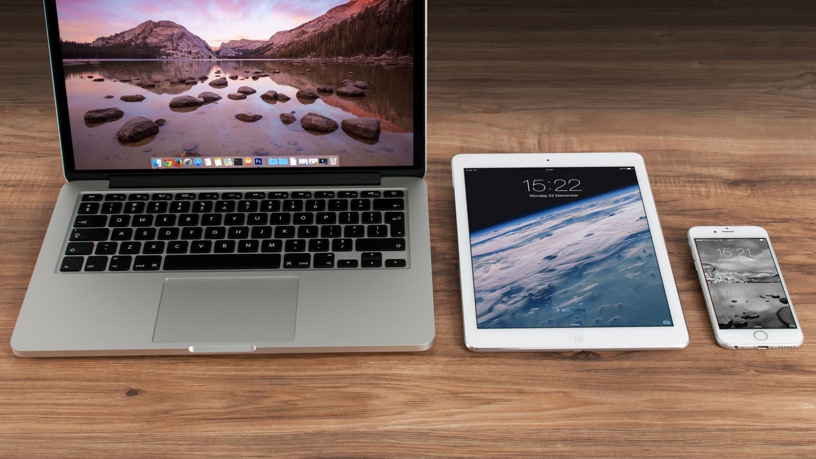 A laptop, a tablet, and a smartphone side by side, the three screen sizes a responsive website has to fit.