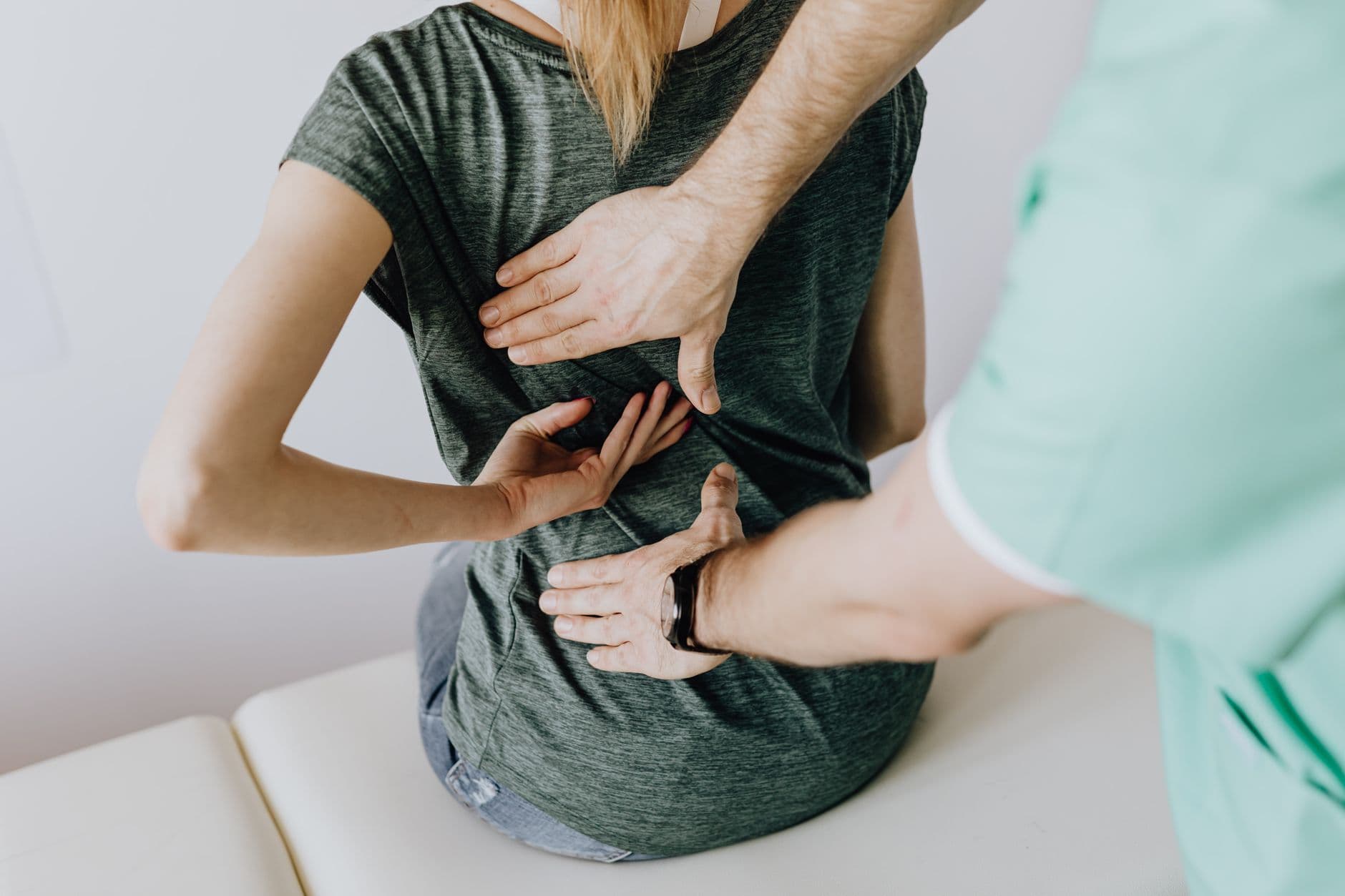 Chiropractor treating a patient's back pain - the kind of high-intent search chiropractic SEO is built to win