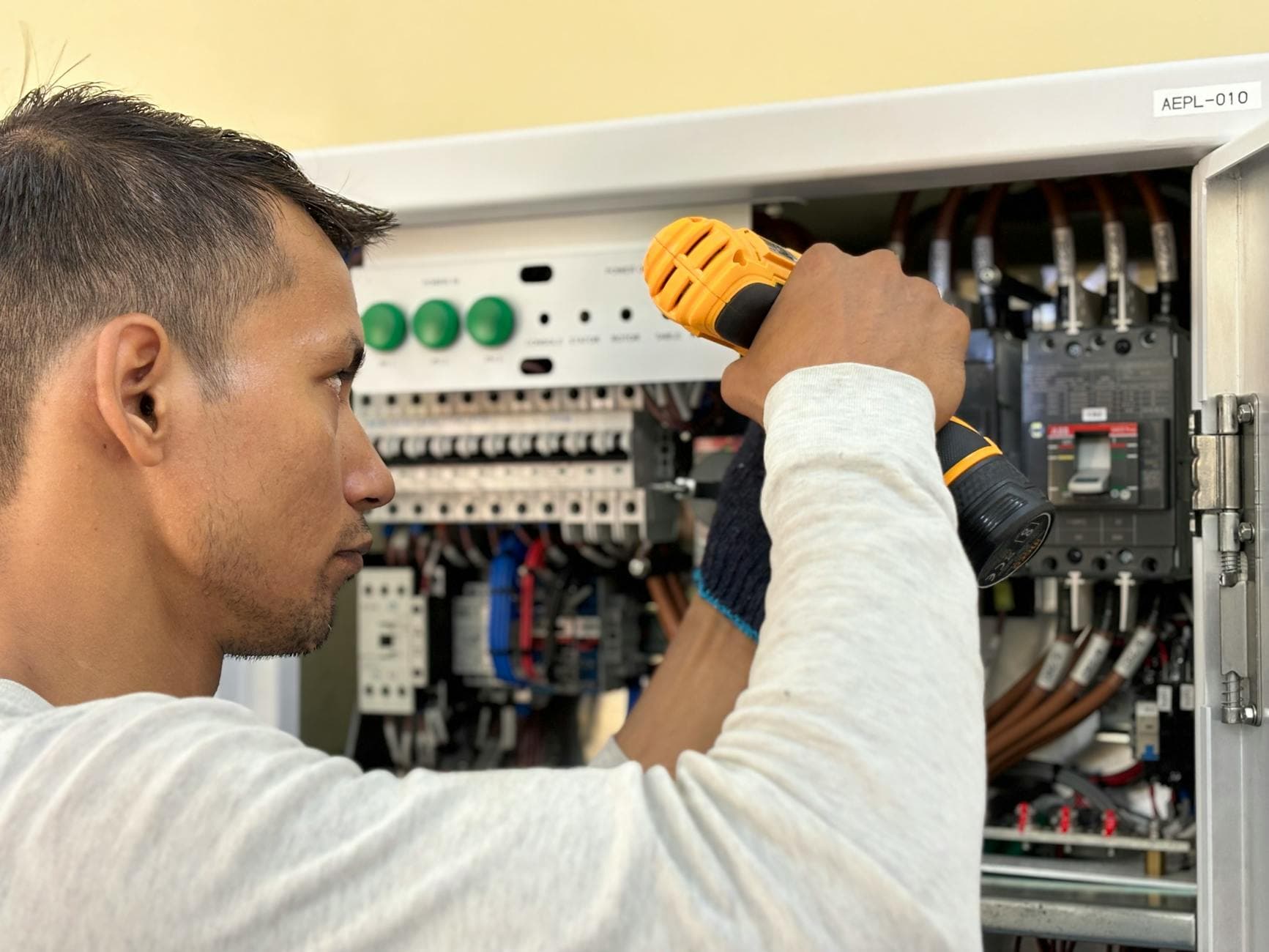 Electrician SEO services - electrician working on a panel, the kind of high-intent search BuzFind helps you win