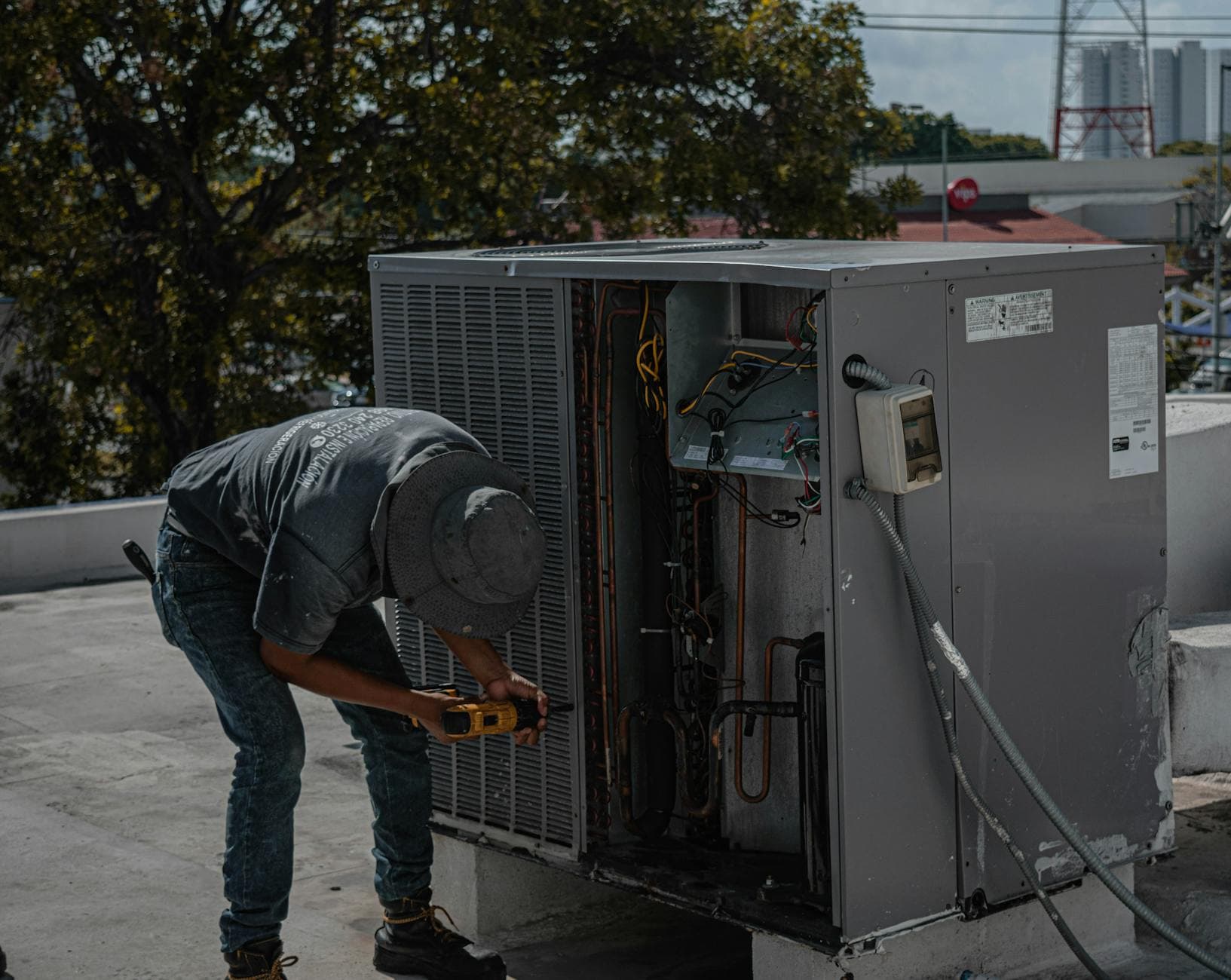 HVAC SEO services - HVAC technician at work, the kind of high-intent search BuzFind helps you win