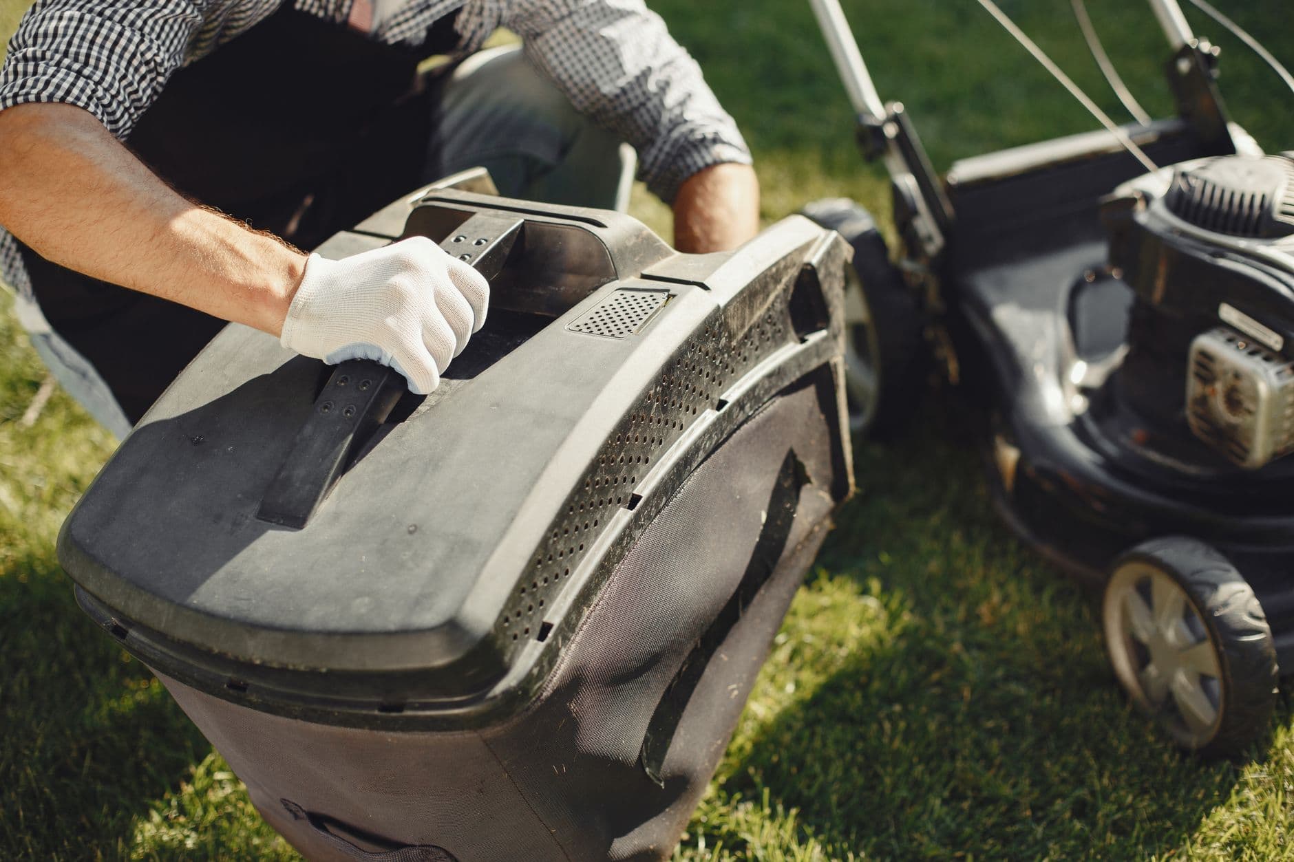 Landscaper SEO services - landscaper mowing a lawn, the kind of high-intent search BuzFind helps you win