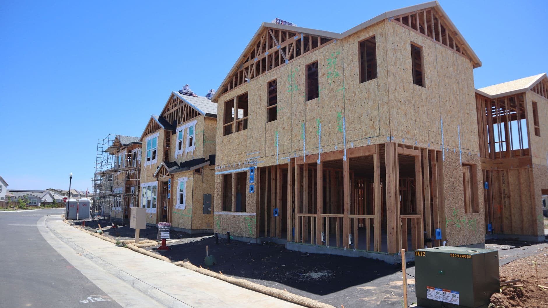 Home under construction in a residential neighborhood - the kind of local remodel and addition project general contractors compete for