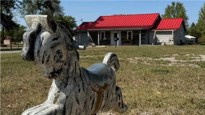 Redkey Park historic pavilion and lake in Redkey, Indiana featuring ancient oak trees, walking paths, and picnic areas