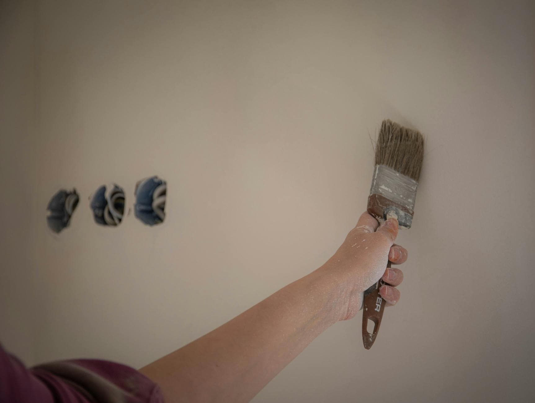 Painter SEO services by BuzFind Painter SEO services - house painter at work, the kind of high-intent search BuzFind helps you win
