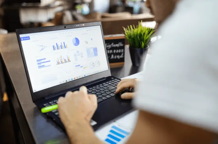 Man analyzing marketing data on a computer